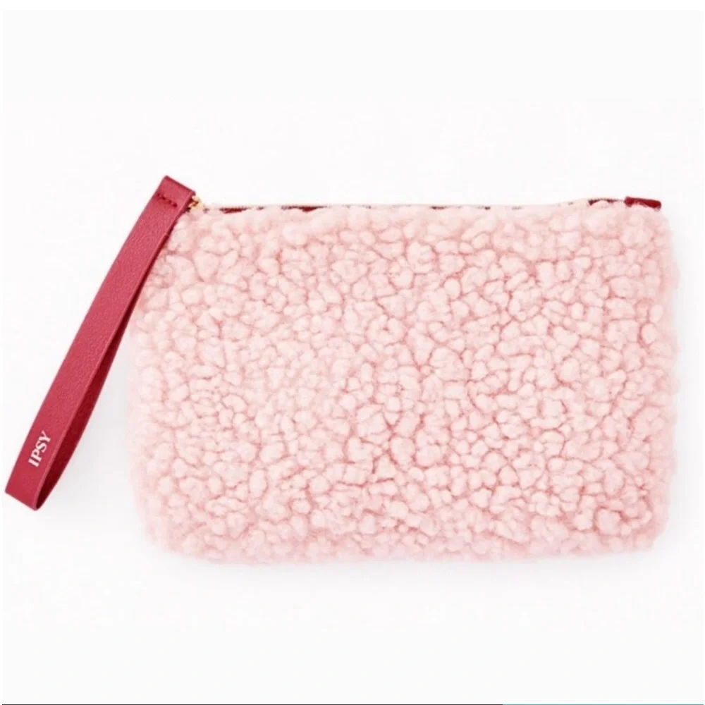 Fuzzy pink‎ makeup bag with maroon zipper pull and inner lining IPSY